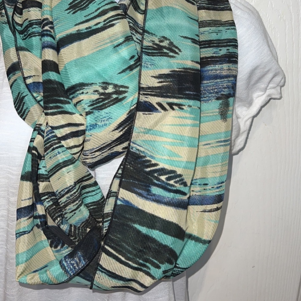 Torquoise, black, and cream colored infinity scarf